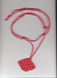 A necklace tied with knots from cording