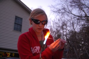 Jeannette making glass beads on a torch flame