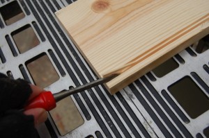 Carefully remove with a chisel