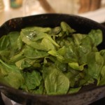 Meat and vegetables set aside, spinach added to hot pan