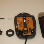 Picture of a disassembled computer mouse.