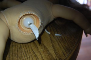 The leg socket has been stitched into back in to the body.  Note the crimped elastic retaining the cup and top of the leg.